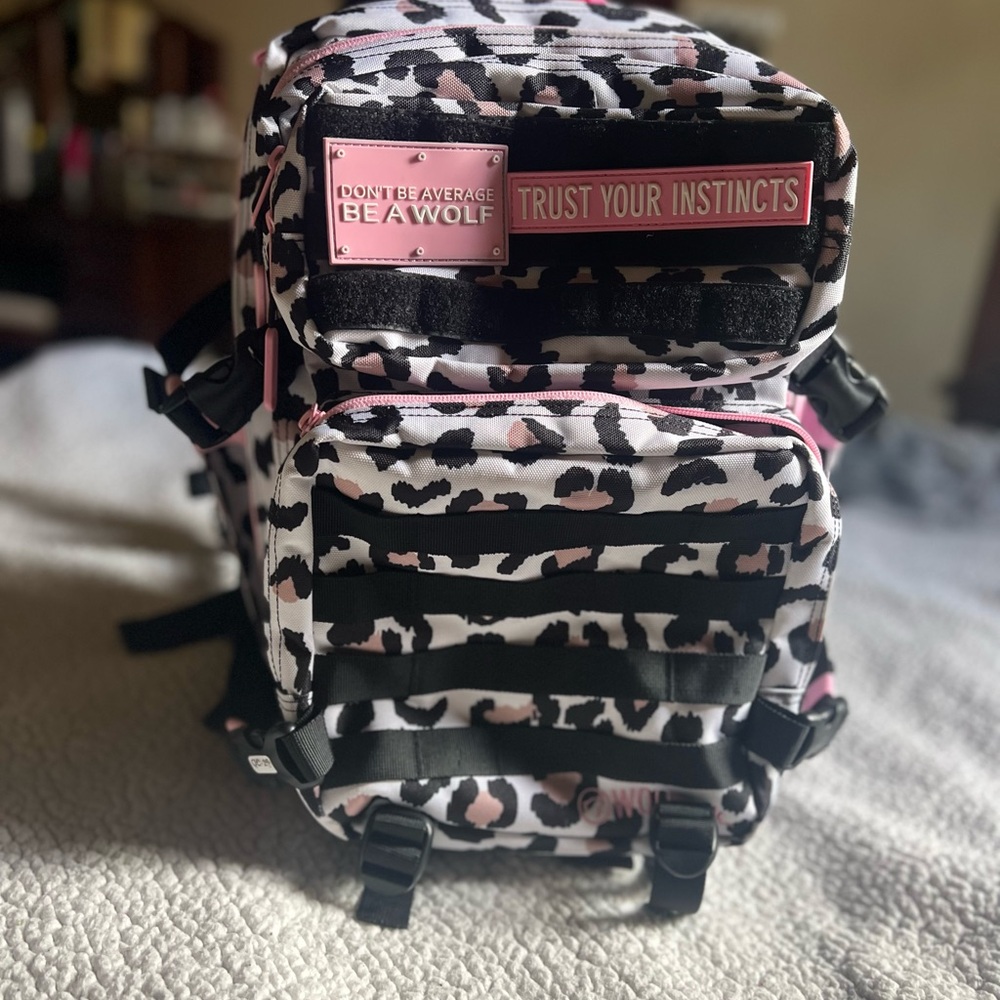 Wolf pack backpack. Pink cheetah.